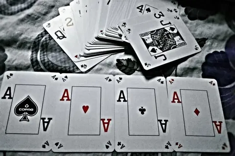 Four aces on a poker table