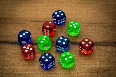 Coloured dice on a wooden table