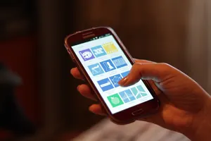 Cherry rush android app store: Smartphone with apps in a hand