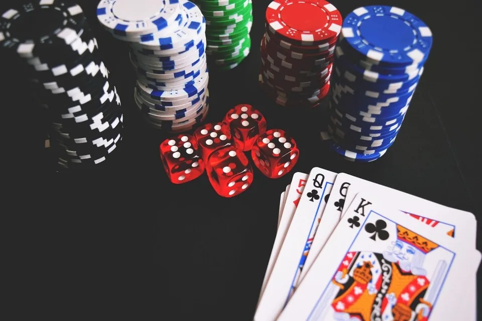Casino chips, cards dice table