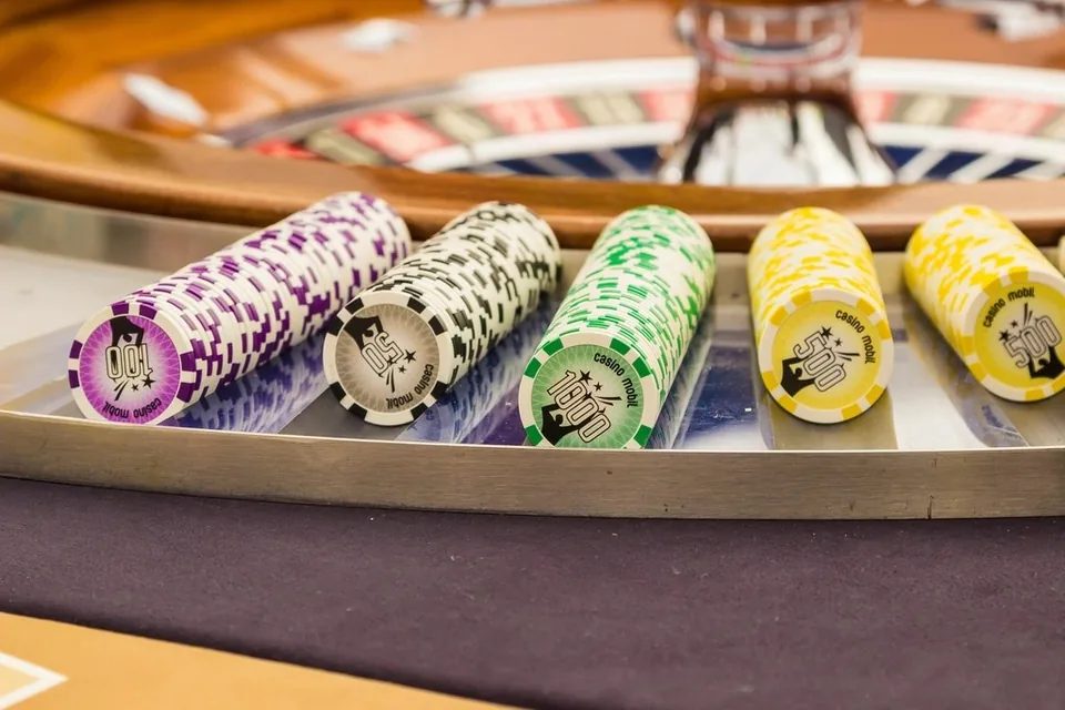 Chips counted out in front of a player