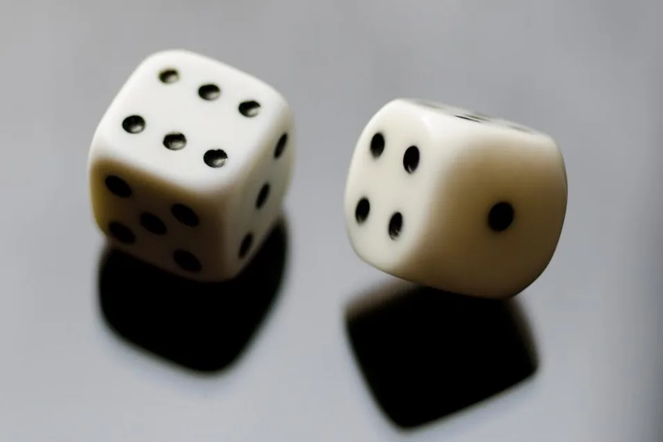 Dice landing beside the chips