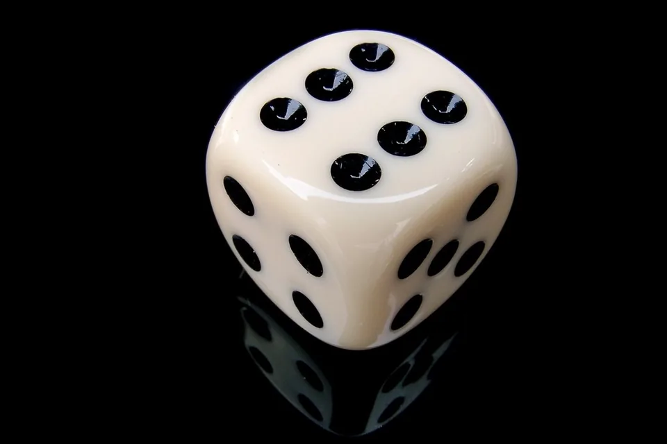 Dice landing beside the chips