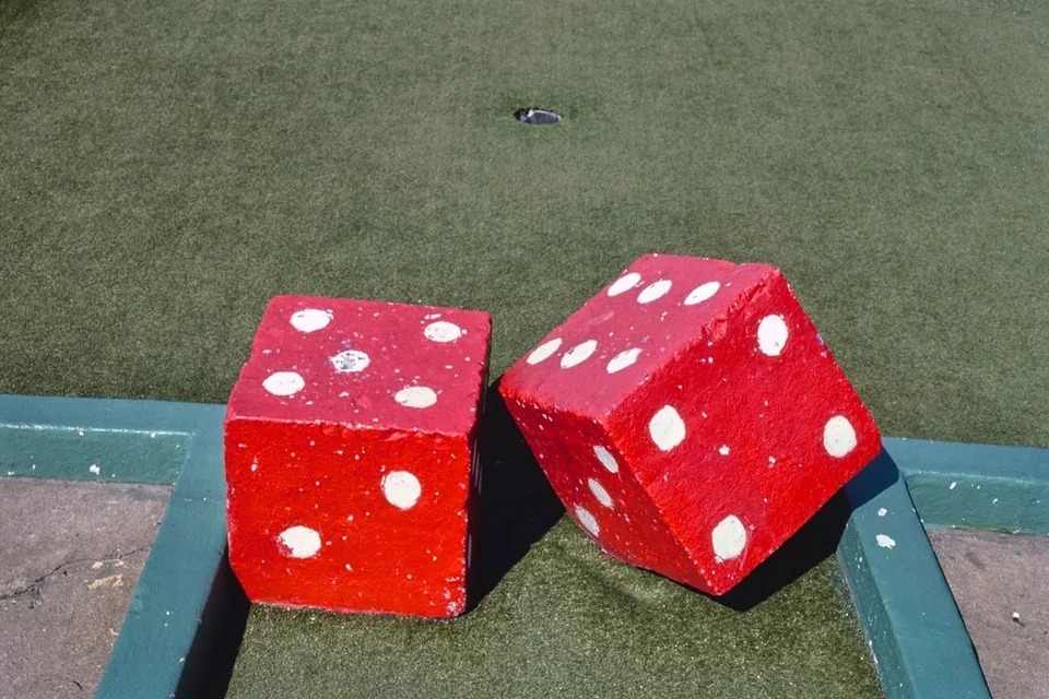 Dice landing beside the chips