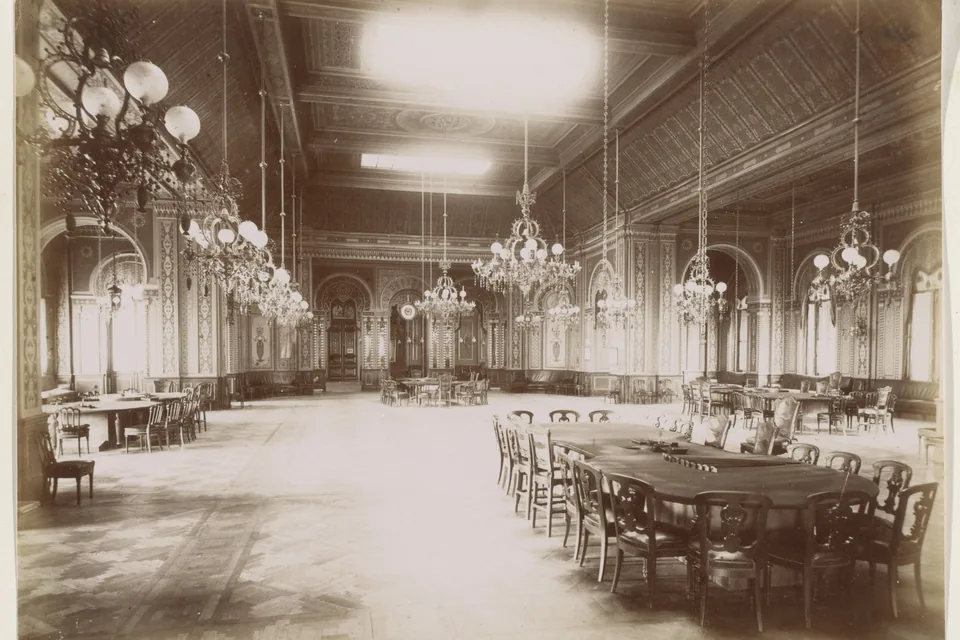Lit gaming hall seen from the aisle