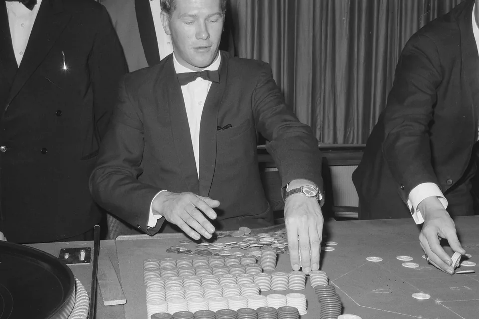 Dealer shuffling at the card table