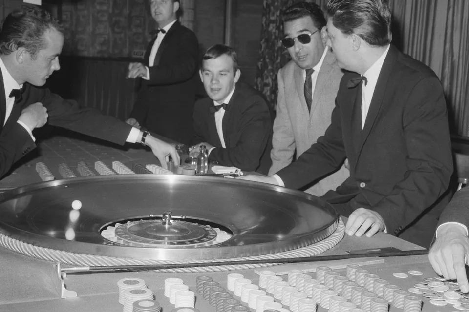 Live table in play with the dealer standing