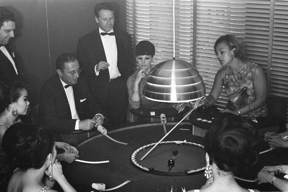 Dealer handling chips at the table