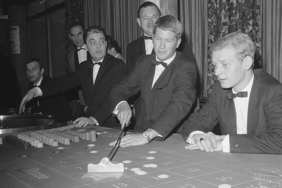 Dealer shuffling at the card table